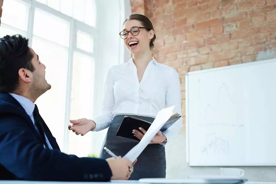 woman laughing with colleague