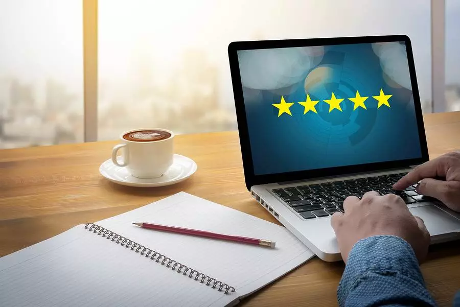 Businessman Holding Five Star Rating