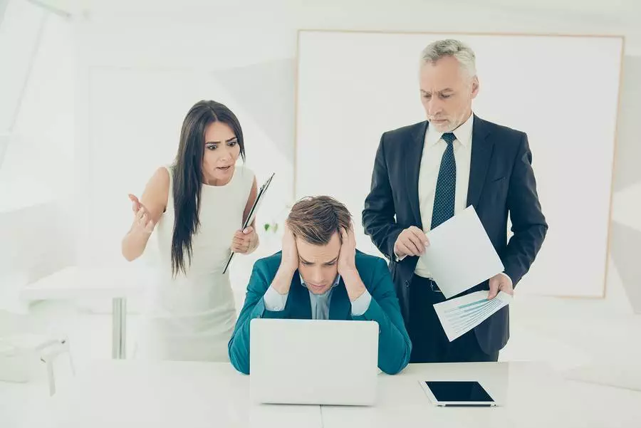 Angry frustrated boss screaming at his worker for bad plan