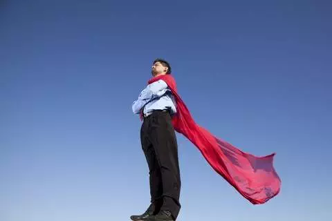 man wearing red cape